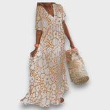 Rochie lungă cu model floral și nasturi