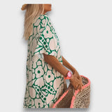 Rochie lungă cu model floral și nasturi