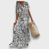 Rochie lungă cu model floral și nasturi